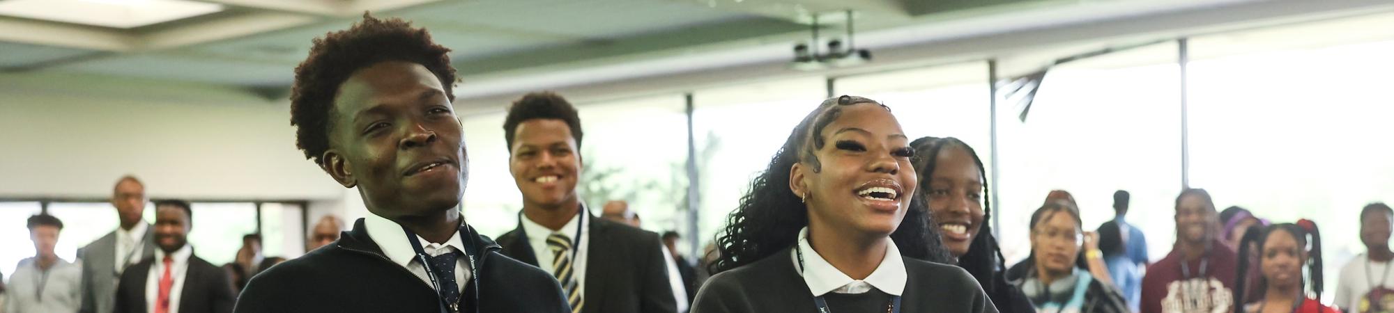 Students laughing and smiling.