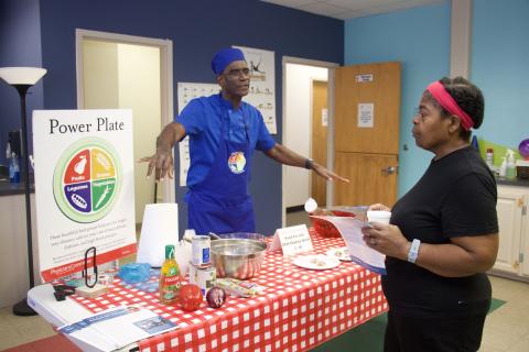 A man talking about healthy food to a woman.
